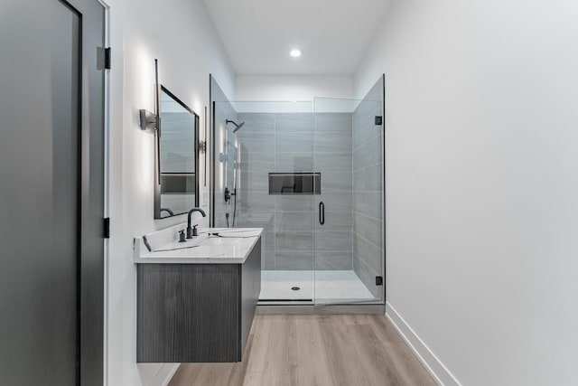 4210 W 5th Ave, Chicago, IL 60624 - bathroom with vanity, wood finished floors, and a shower stall