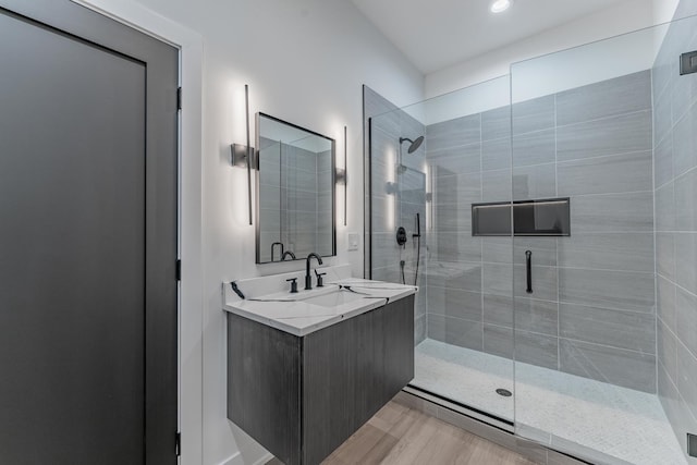 4210 W 5th Ave, Chicago, IL 60624 - bathroom with a shower stall, vanity, wood finished floors, and recessed lighting