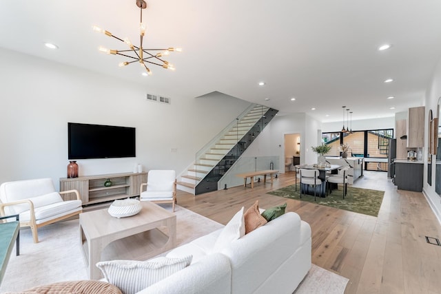 4210 W 5th Ave, Chicago, IL 60624 - living area featuring a chandelier, stairs, recessed lighting, and light wood finished floors