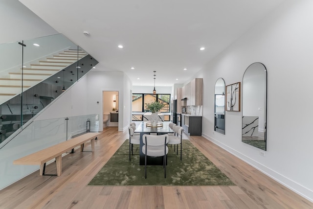 4210 W 5th Ave, Chicago, IL 60624 - dining space featuring stairs, light wood-style flooring, and recessed lighting