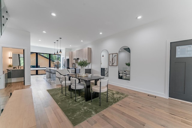 4210 W 5th Ave, Chicago, IL 60624 - dining room featuring light wood-style flooring and recessed lighting