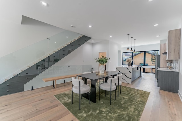 4210 W 5th Ave, Chicago, IL 60624 - dining space with light wood-style floors, stairs, and recessed lighting
