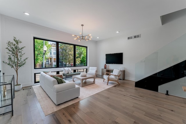 4210 W 5th Ave, Chicago, IL 60624 - living room with a chandelier, light wood-style floors, and recessed lighting