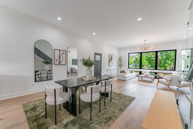 4210 W 5th Ave, Chicago, IL 60624 - dining space featuring light wood-type flooring, a chandelier, and recessed lighting