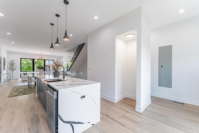 4210 W 5th Ave, Chicago, IL 60624 - kitchen with electric panel, light wood finished floors, a center island with sink, pendant lighting, and recessed lighting