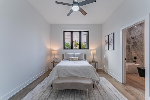 4210 W 5th Ave, Chicago, IL 60624 - bedroom with light wood finished floors, ceiling fan, and connected bathroom