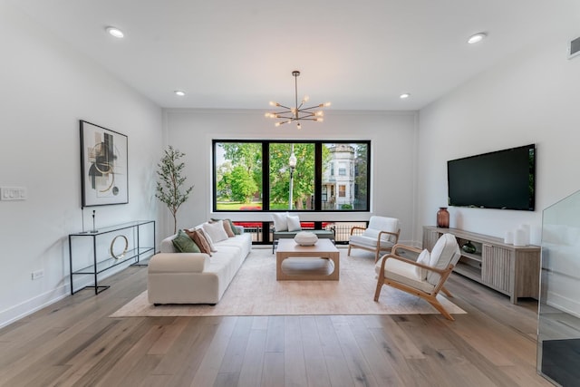 4210 W 5th Ave, Chicago, IL 60624 - living area featuring a chandelier, wood finished floors, and recessed lighting