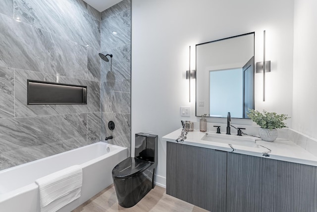 4210 W 5th Ave, Chicago, IL 60624 - bathroom with vanity, shower / bath combination, and wood finished floors