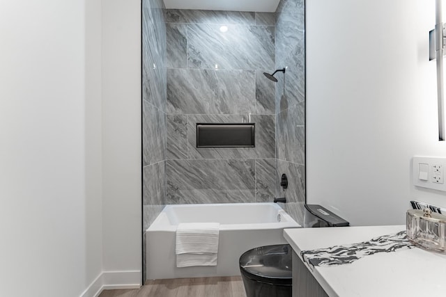 4210 W 5th Ave, Chicago, IL 60624 - bathroom with washtub / shower combination, wood finished floors, and vanity