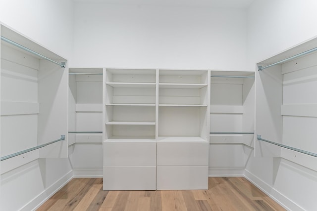 4210 W 5th Ave, Chicago, IL 60624 - walk in closet featuring wood finished floors