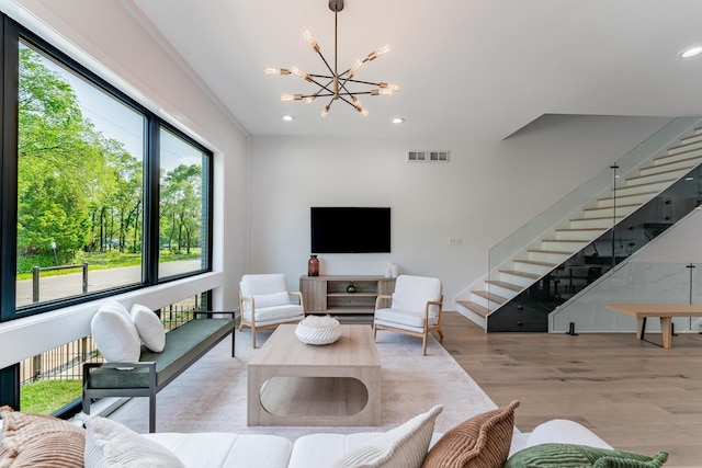 4210 W 5th Ave, Chicago, IL 60624 - living area with a chandelier, wood finished floors, stairs, and recessed lighting