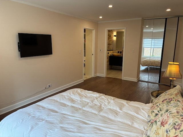 1103 S Hunt Club Dr Unit 125, Mount Prospect, IL 60056 - bedroom featuring ornamental molding, wood finished floors, recessed lighting, a closet, and connected bathroom