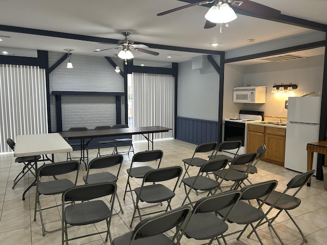 1103 S Hunt Club Dr Unit 125, Mount Prospect, IL 60056 - recreation room featuring a ceiling fan, light tile patterned floors, and a wainscoted wall