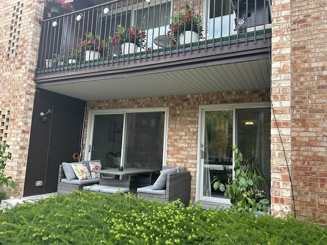 1103 S Hunt Club Dr Unit 125, Mount Prospect, IL 60056 - back of property featuring brick siding and a balcony