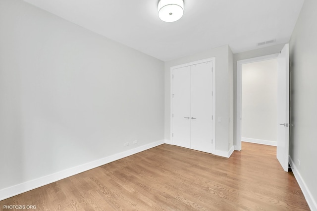 3321 N Sheffield Ave Unit 4, Chicago, IL 60657 - unfurnished bedroom with light wood-style floors and a closet