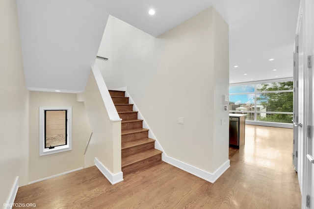 3321 N Sheffield Ave Unit 4, Chicago, IL 60657 - stairs with wood finished floors, recessed lighting, and floor to ceiling windows
