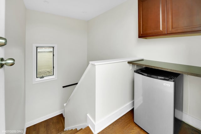 3321 N Sheffield Ave Unit 4, Chicago, IL 60657 - laundry area featuring wood finished floors