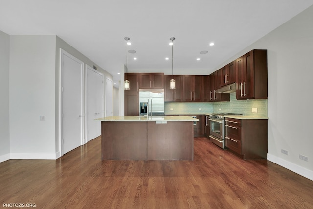 3321 N Sheffield Ave Unit 4, Chicago, IL 60657 - kitchen featuring high end appliances, light countertops, dark wood-style flooring, and a kitchen island