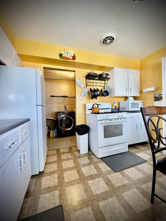 15235 Cottage Grove Ave, Dolton, IL 60419 - kitchen featuring white appliances, washer / clothes dryer, white cabinets, and light flooring