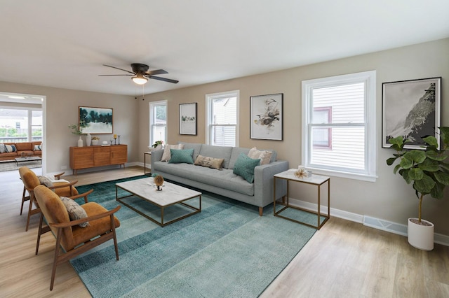 9934 Herrick Ave, Franklin Park, IL 60131 - living area featuring light wood-style flooring, plenty of natural light, and ceiling fan