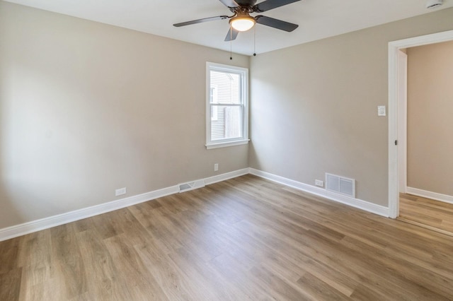 9934 Herrick Ave, Franklin Park, IL 60131 - spare room featuring light wood-style floors, a ceiling fan, and a smoke detector
