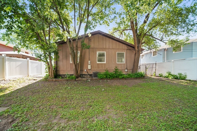1025 S Ardmore Ave, Villa Park, IL 60181 - rear view of house featuring a fenced backyard, board and batten siding, and crawl space