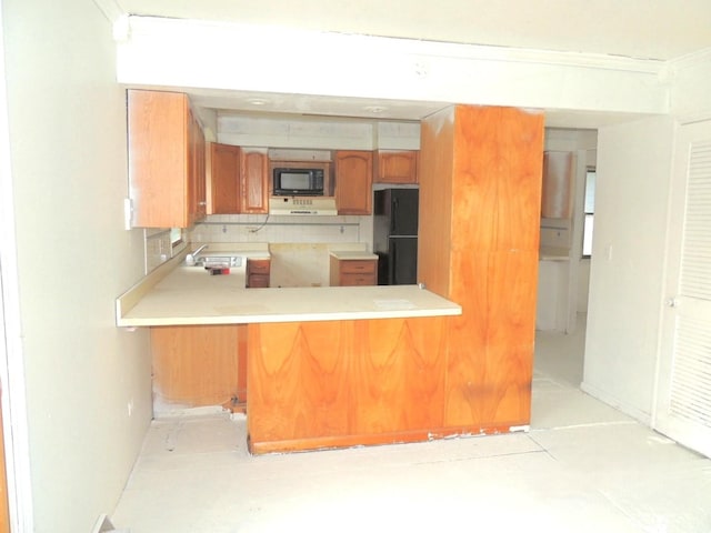 1025 S Ardmore Ave, Villa Park, IL 60181 - kitchen featuring black appliances, light countertops, decorative backsplash, and a peninsula