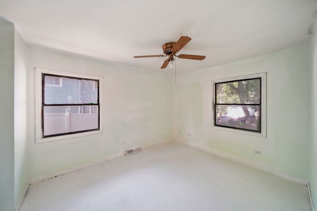 1025 S Ardmore Ave, Villa Park, IL 60181 - spare room featuring concrete flooring and ceiling fan