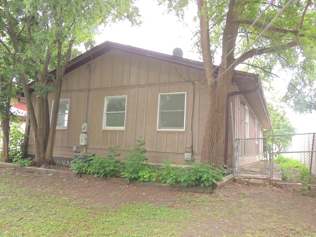 1025 S Ardmore Ave, Villa Park, IL 60181 - view of home's exterior featuring board and batten siding and a gate