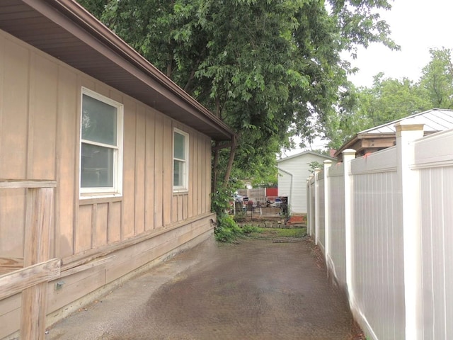 1025 S Ardmore Ave, Villa Park, IL 60181 - view of property exterior with board and batten siding and a patio