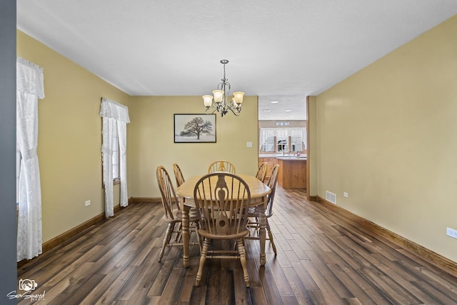 131 E Main St, Essex, IL 60935 - dining area featuring dark wood-style flooring and a chandelier