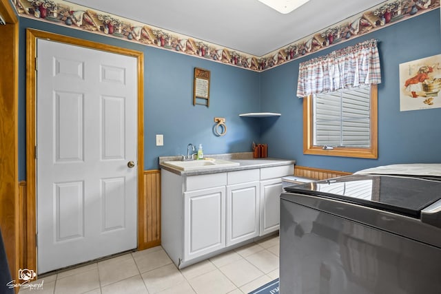 131 E Main St, Essex, IL 60935 - laundry room featuring washing machine and dryer, light tile patterned flooring, and cabinet space