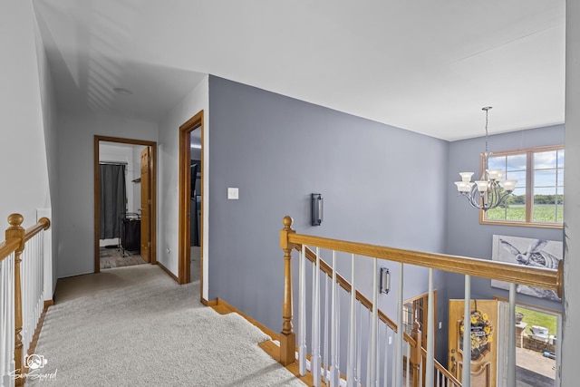 131 E Main St, Essex, IL 60935 - hall with an upstairs landing, a chandelier, and carpet flooring
