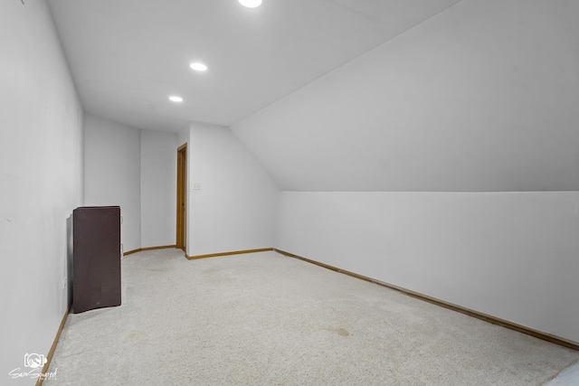 131 E Main St, Essex, IL 60935 - additional living space featuring vaulted ceiling, recessed lighting, and carpet
