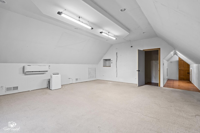 131 E Main St, Essex, IL 60935 - additional living space featuring carpet floors, vaulted ceiling, and a wall mounted air conditioner