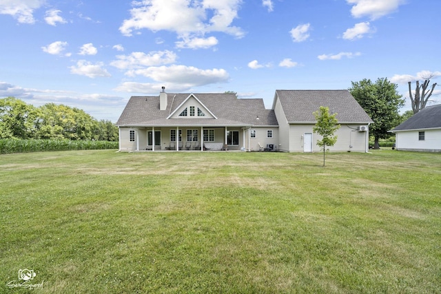 131 E Main St, Essex, IL 60935 - back of house featuring a yard, a porch, and a chimney