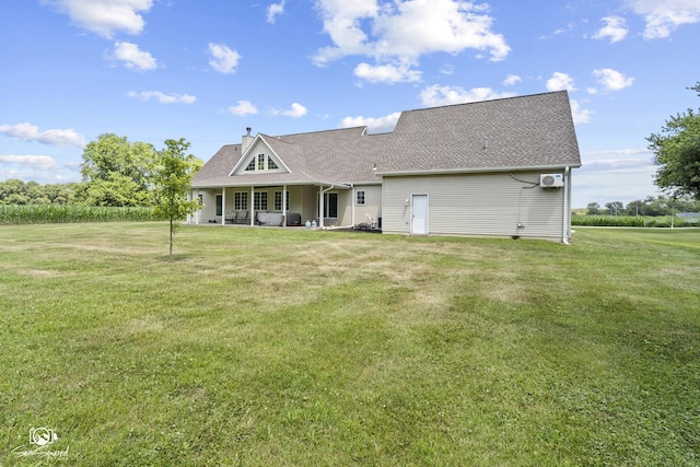 131 E Main St, Essex, IL 60935 - view of front of home featuring a front lawn, a chimney, a shingled roof, and covered porch