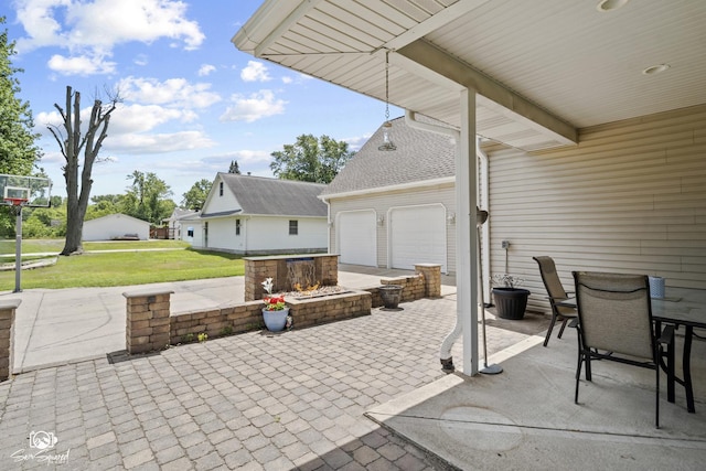 131 E Main St, Essex, IL 60935 - view of patio featuring an attached garage