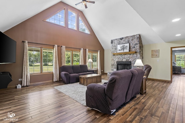 131 E Main St, Essex, IL 60935 - living area featuring ceiling fan, dark wood finished floors, a fireplace, and high vaulted ceiling