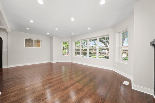 7711 S Honore St, Chicago, IL 60620 - unfurnished living room with wood finished floors, recessed lighting, and arched walkways