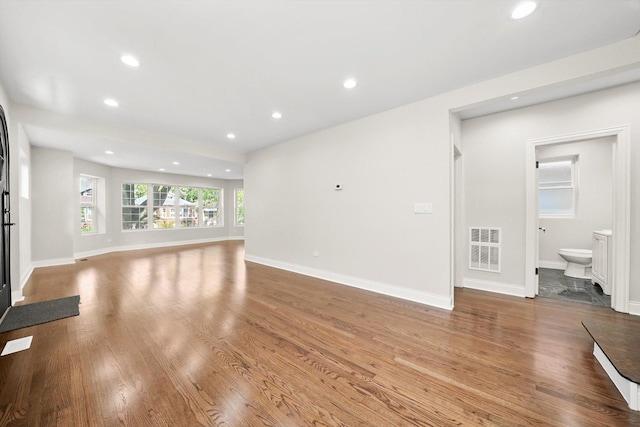 7711 S Honore St, Chicago, IL 60620 - unfurnished living room with wood finished floors and recessed lighting