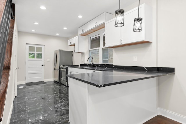 7711 S Honore St, Chicago, IL 60620 - kitchen with gas stove, recessed lighting, dark countertops, white cabinetry, and a peninsula