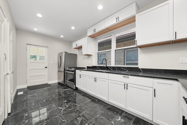 7711 S Honore St, Chicago, IL 60620 - kitchen with appliances with stainless steel finishes, white cabinets, recessed lighting, dark marble finish flooring, and dark countertops