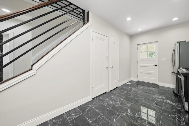 7711 S Honore St, Chicago, IL 60620 - foyer featuring dark marble finish flooring, stairway, and recessed lighting