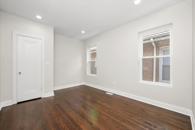 7711 S Honore St, Chicago, IL 60620 - spare room with dark wood-style floors and recessed lighting