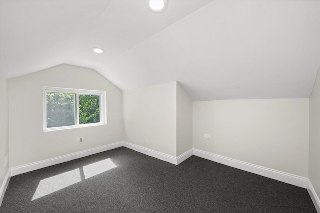 7711 S Honore St, Chicago, IL 60620 - additional living space featuring vaulted ceiling, dark colored carpet, and recessed lighting