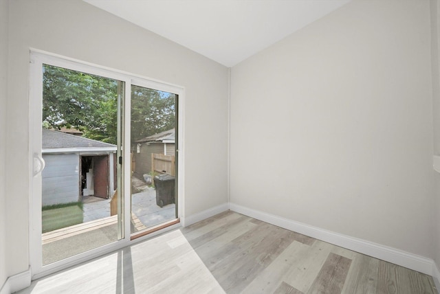 7711 S Honore St, Chicago, IL 60620 - empty room with wood finished floors and baseboards