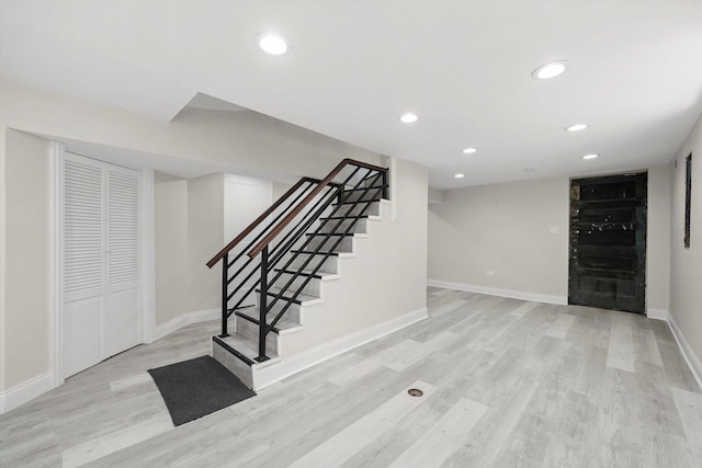 7711 S Honore St, Chicago, IL 60620 - finished below grade area featuring wood finished floors, stairway, and recessed lighting