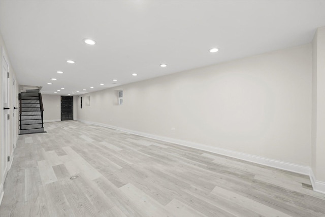 7711 S Honore St, Chicago, IL 60620 - unfurnished living room with stairs, recessed lighting, and light wood-type flooring