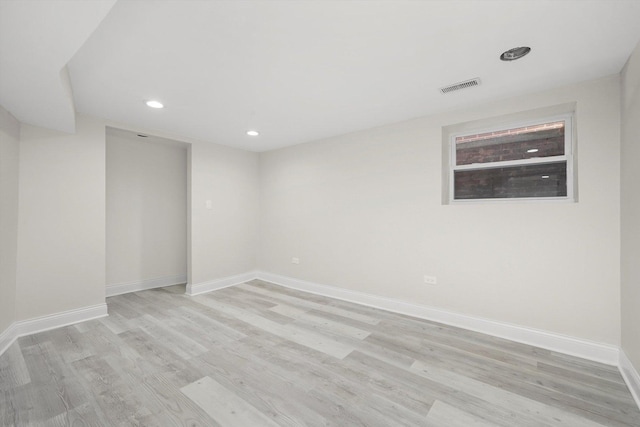 7711 S Honore St, Chicago, IL 60620 - empty room featuring light wood finished floors and recessed lighting